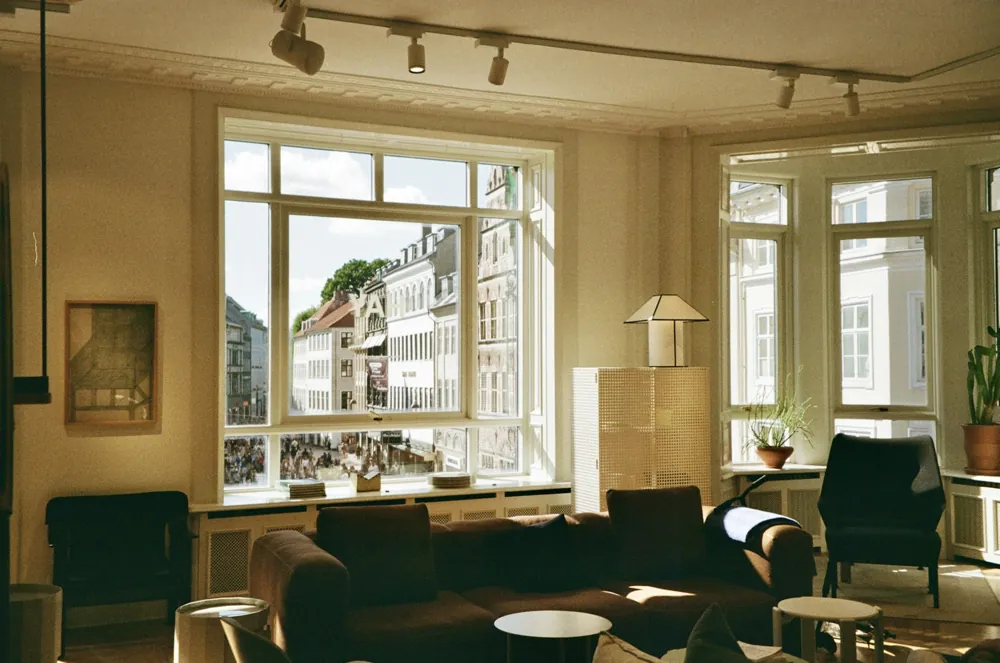 A living room with generous windows and a street outlook